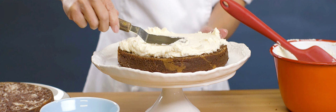 chef building cake products article
